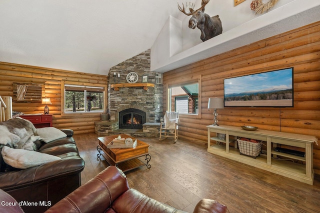 27294 N Clagstone Rd, Athol, ID 83801 - living room featuring high vaulted ceiling, a stone fireplace, hardwood / wood-style floors, and rustic walls