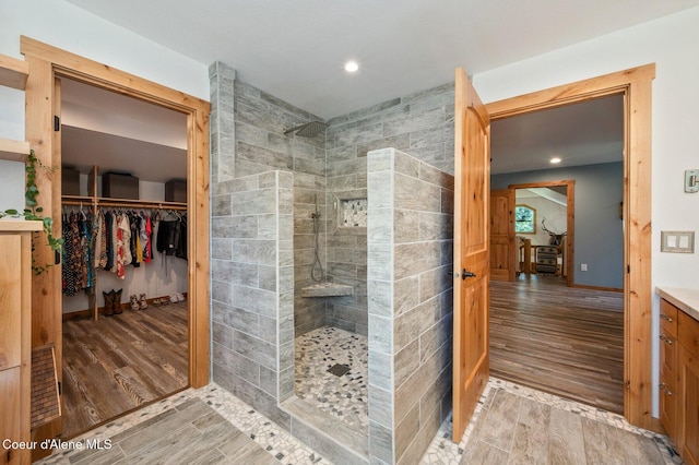 27294 N Clagstone Rd, Athol, ID 83801 - bathroom featuring wood finished floors, a walk in shower, vanity, and recessed lighting