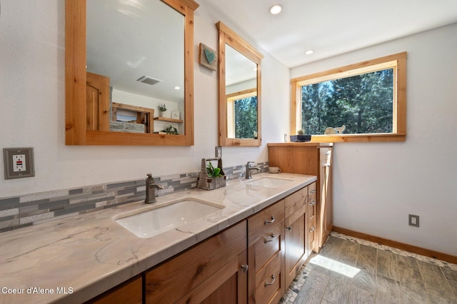 27294 N Clagstone Rd, Athol, ID 83801 - full bath with double vanity, wood finished floors, baseboards, and recessed lighting