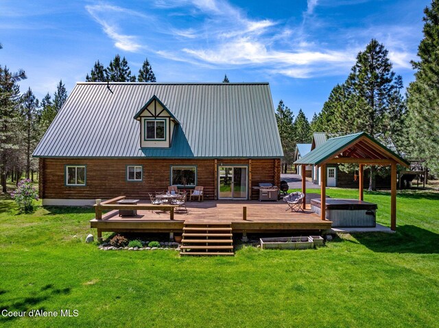 27294 N Clagstone Rd, Athol, ID 83801 - rear view of house featuring a gazebo, a deck, a lawn, metal roof, and log siding