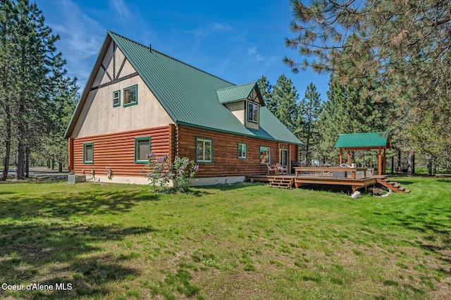 27294 N Clagstone Rd, Athol, ID 83801 - rear view of property featuring a deck, log siding, a yard, cooling unit, and metal roof