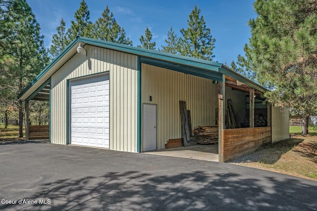 27294 N Clagstone Rd, Athol, ID 83801 - garage with a garage and asphalt driveway