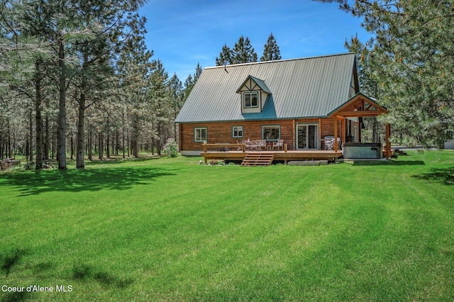 27294 N Clagstone Rd, Athol, ID 83801 - rear view of property with a wooden deck, a lawn, a hot tub, and metal roof
