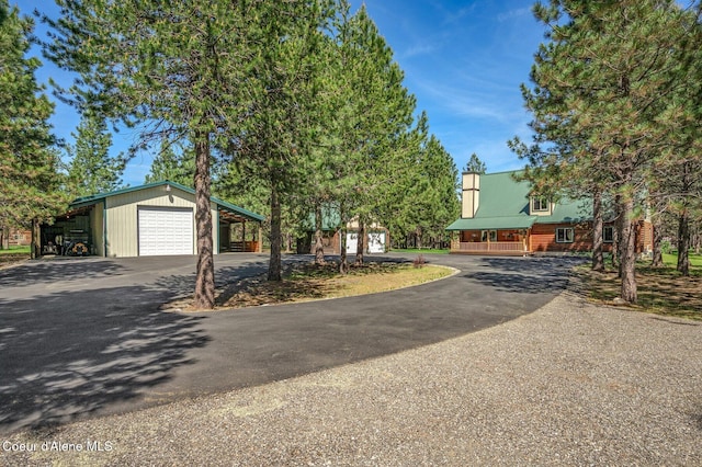 27294 N Clagstone Rd, Athol, ID 83801 - view of front of home with driveway, a garage, and an outbuilding