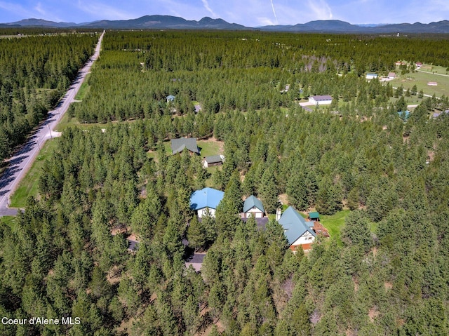 27294 N Clagstone Rd, Athol, ID 83801 - aerial view of property's location with a heavily wooded area and a mountainous background