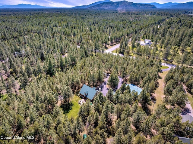 27294 N Clagstone Rd, Athol, ID 83801 - drone / aerial view of a heavily wooded area and a mountainous background