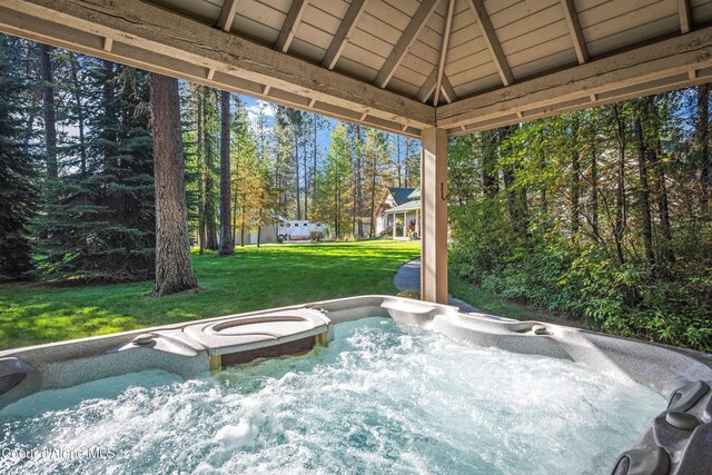 30000 N Caribou Ave, Athol, ID 83801 - view of patio / terrace with a hot tub and view of wooded area