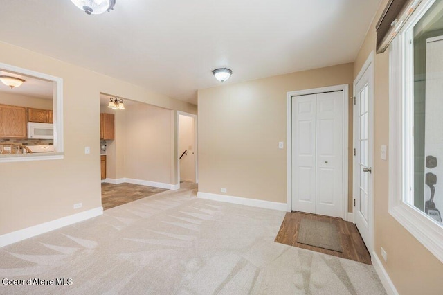 103 3rd St, Wallace, ID 83873 - entrance foyer with light carpet and baseboards