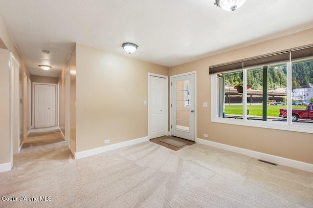 103 3rd St, Wallace, ID 83873 - foyer featuring baseboards and carpet