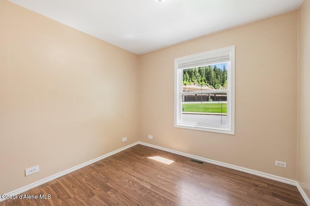 103 3rd St, Wallace, ID 83873 - unfurnished room with baseboards and wood finished floors