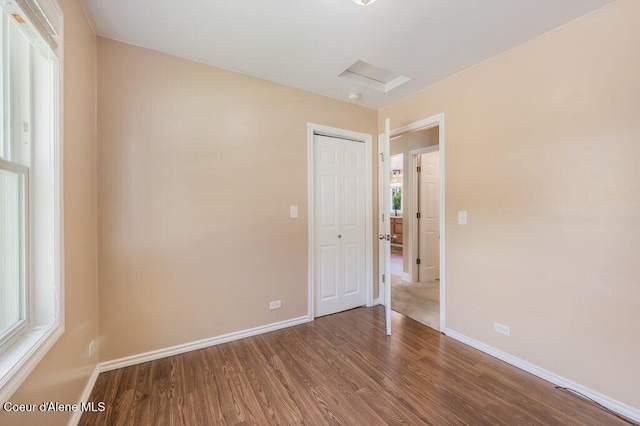 103 3rd St, Wallace, ID 83873 - unfurnished room featuring wood finished floors and baseboards