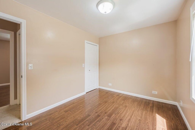 103 3rd St, Wallace, ID 83873 - unfurnished room featuring wood finished floors and baseboards