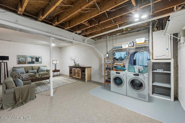 103 3rd St, Wallace, ID 83873 - unfinished basement featuring washing machine and dryer, electric panel, and carpet flooring