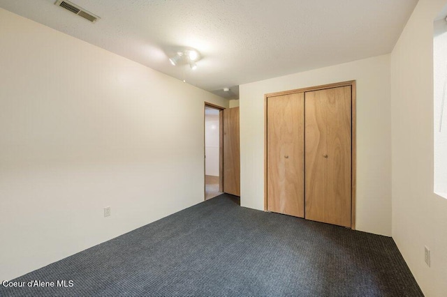 103 3rd St, Wallace, ID 83873 - unfurnished bedroom with carpet floors and a closet