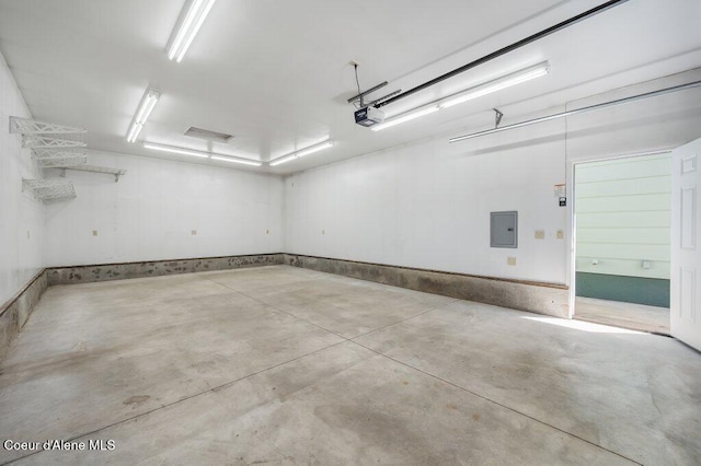 103 3rd St, Wallace, ID 83873 - garage featuring electric panel and a garage door opener