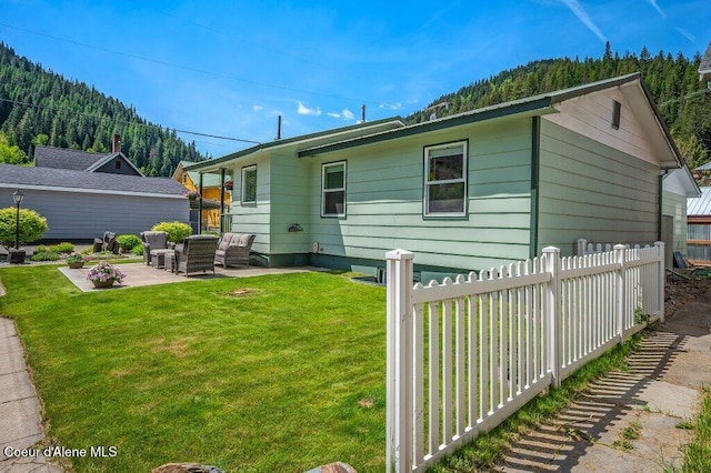 103 3rd St, Wallace, ID 83873 - rear view of property featuring a patio and an outdoor living space