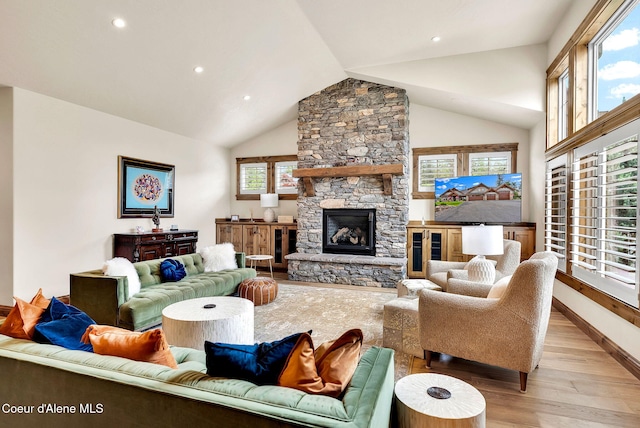 11690 N Arnicas Ct, Hayden, ID 83835 - living area with light wood finished floors, healthy amount of natural light, recessed lighting, baseboards, and high vaulted ceiling
