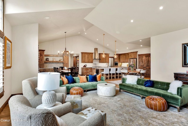 11690 N Arnicas Ct, Hayden, ID 83835 - living area with recessed lighting, a chandelier, high vaulted ceiling, and baseboards