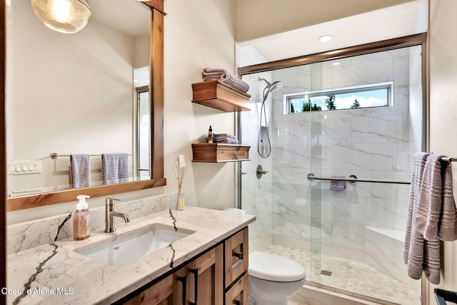 11690 N Arnicas Ct, Hayden, ID 83835 - bathroom with toilet, vanity, and a stall shower