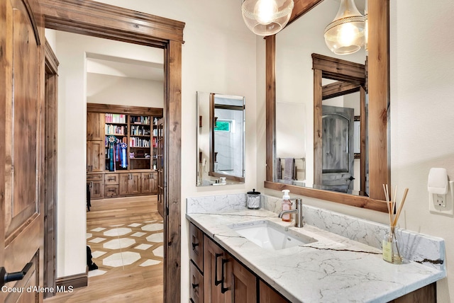 11690 N Arnicas Ct, Hayden, ID 83835 - bathroom featuring vanity and wood finished floors