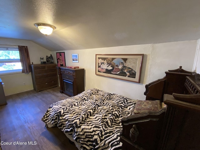 176 King St, Wallace, ID 83873 - bedroom featuring dark wood-type flooring and lofted ceiling