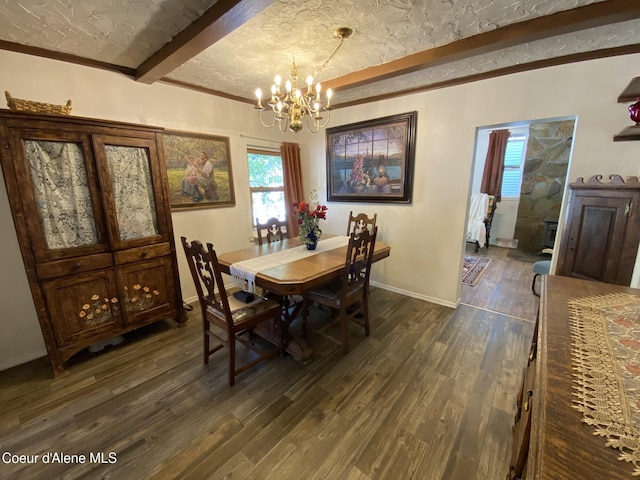 176 King St, Wallace, ID 83873 - dining area with beamed ceiling, a chandelier, dark wood finished floors, and baseboards