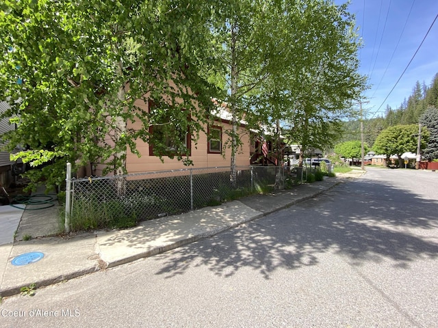 176 King St, Wallace, ID 83873 - view of home's exterior with a fenced front yard