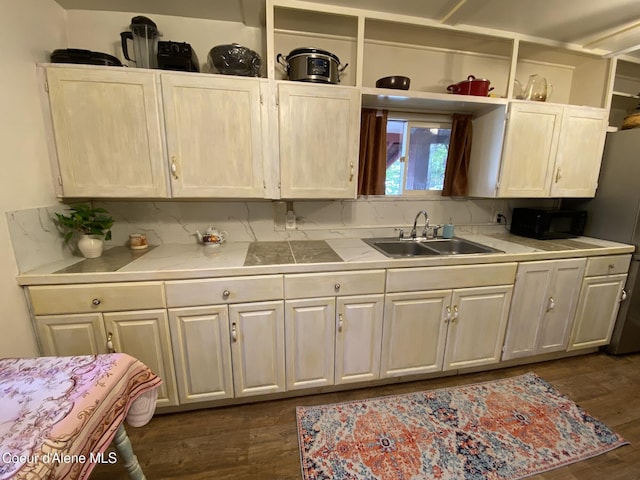 176 King St, Wallace, ID 83873 - kitchen with a sink, black microwave, tile counters, dark wood-type flooring, and open shelves