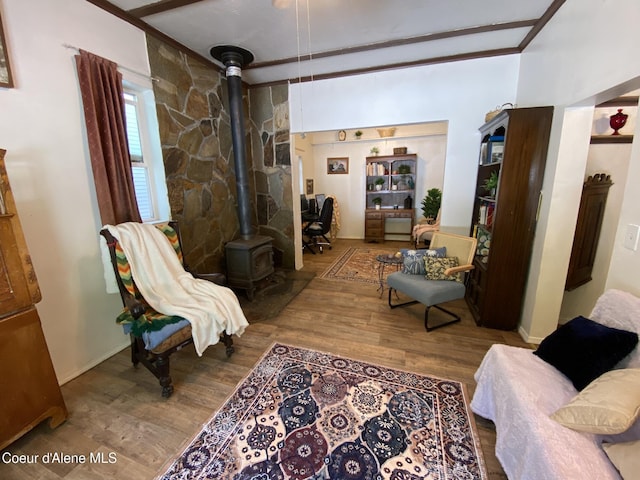 176 King St, Wallace, ID 83873 - sitting room with a wood stove and wood finished floors