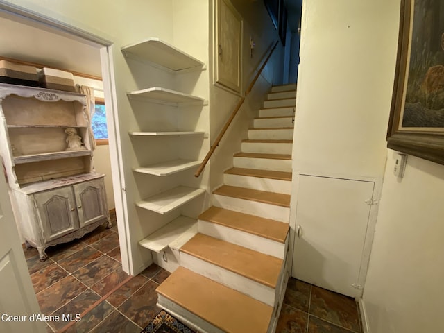 176 King St, Wallace, ID 83873 - staircase featuring stone finish floors