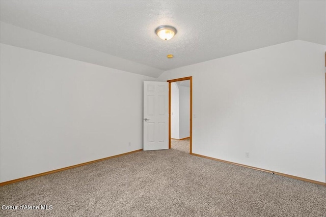 22884 S High Dr, Worley, ID 83876 - unfurnished room with carpet, vaulted ceiling, baseboards, and a textured ceiling