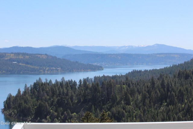 22884 S High Dr, Worley, ID 83876 - view of mountain backdrop with a forest and a nearby body of water