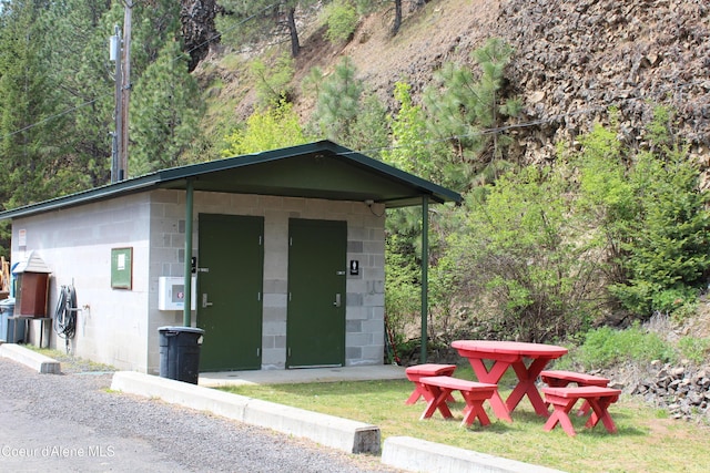 22884 S High Dr, Worley, ID 83876 - view of outbuilding featuring a view of trees