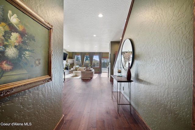 11387 N Armonia Way, Hayden Lake, ID 83835 - hallway featuring wood finished floors, a textured ceiling, recessed lighting, and a textured wall