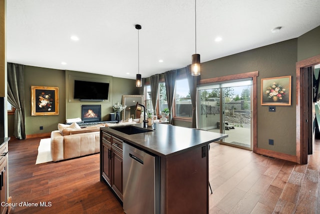 11387 N Armonia Way, Hayden Lake, ID 83835 - kitchen with a sink, dark countertops, wood finished floors, stainless steel dishwasher, and baseboards