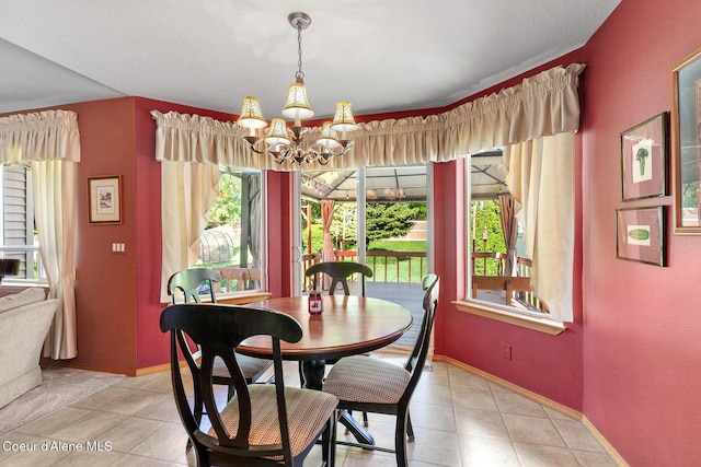 3391 W Loxton Loop, Coeur Dalene, ID 83815 - dining space featuring a chandelier, baseboards, and light tile patterned floors