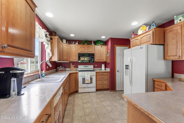3391 W Loxton Loop, Coeur Dalene, ID 83815 - kitchen featuring white appliances, a sink, light countertops, recessed lighting, and brown cabinetry