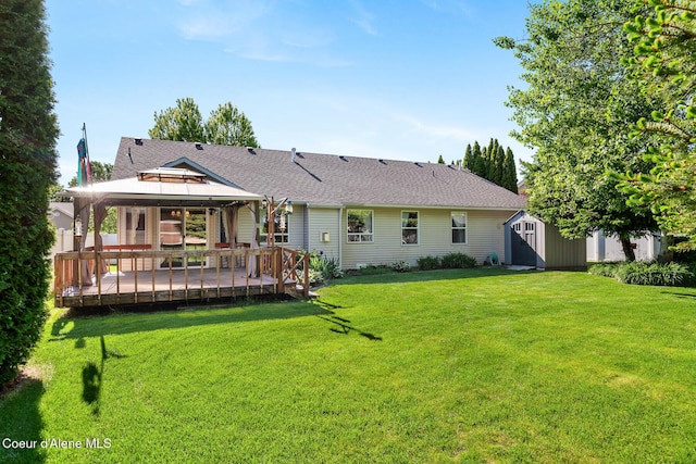 3391 W Loxton Loop, Coeur Dalene, ID 83815 - rear view of house featuring a gazebo, a lawn, a deck, and a shingled roof