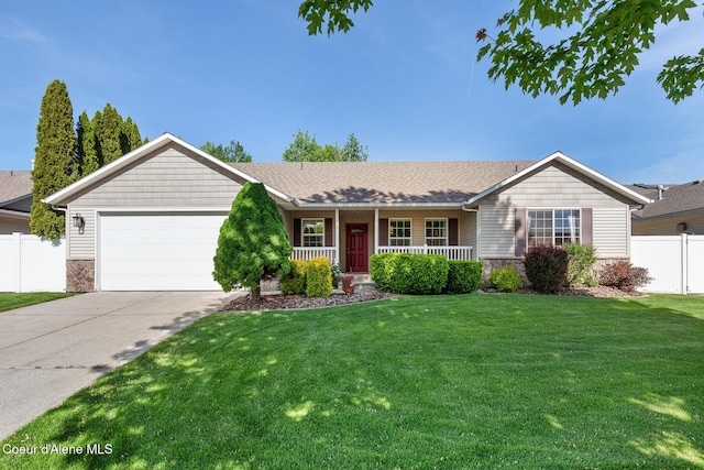 3391 W Loxton Loop, Coeur Dalene, ID 83815 - ranch-style home with stone siding, covered porch, an attached garage, and driveway