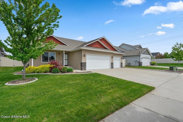 6463 W Conner St, Rathdrum, ID 83858 - view of front of house with a garage, concrete driveway, stone siding, and a shingled roof