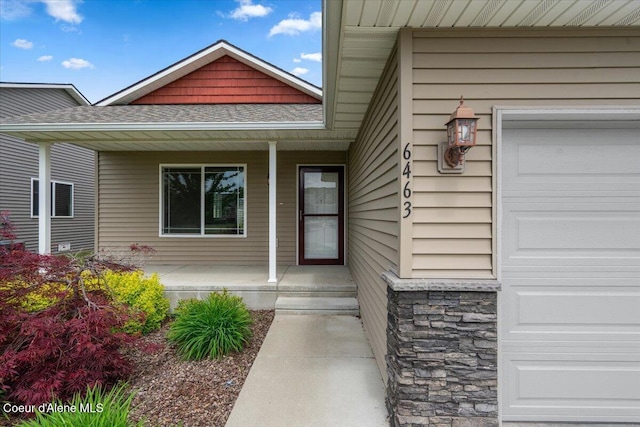 6463 W Conner St, Rathdrum, ID 83858 - entrance to property with a porch, a shingled roof, and stone siding