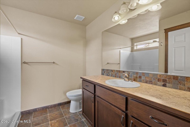 6463 W Conner St, Rathdrum, ID 83858 - full bath featuring vanity, a shower, backsplash, and stone finish flooring