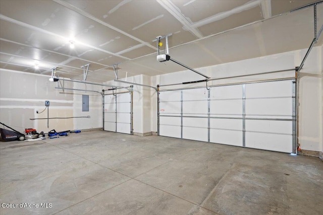 6463 W Conner St, Rathdrum, ID 83858 - garage featuring a garage door opener and electric panel