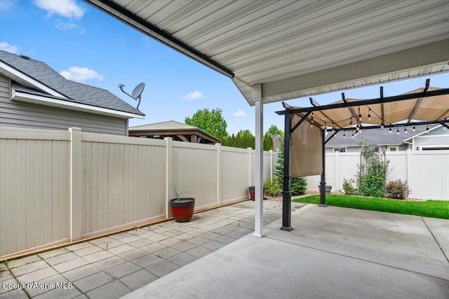 6463 W Conner St, Rathdrum, ID 83858 - fenced backyard with a patio and a pergola