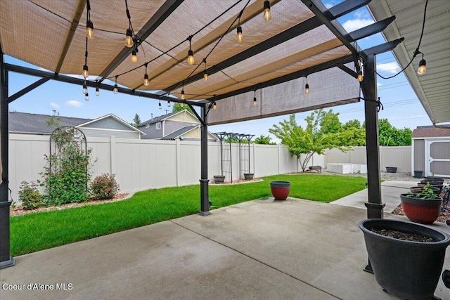 6463 W Conner St, Rathdrum, ID 83858 - fenced backyard featuring a pergola, a patio area, and a shed