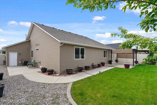 6463 W Conner St, Rathdrum, ID 83858 - rear view of property with a pergola, a patio area, and a shingled roof
