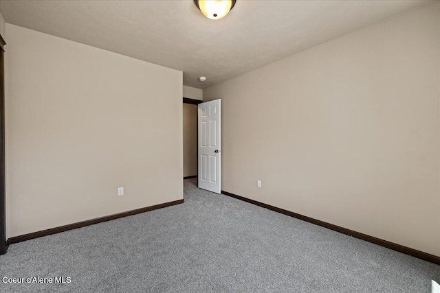 6463 W Conner St, Rathdrum, ID 83858 - carpeted spare room featuring baseboards