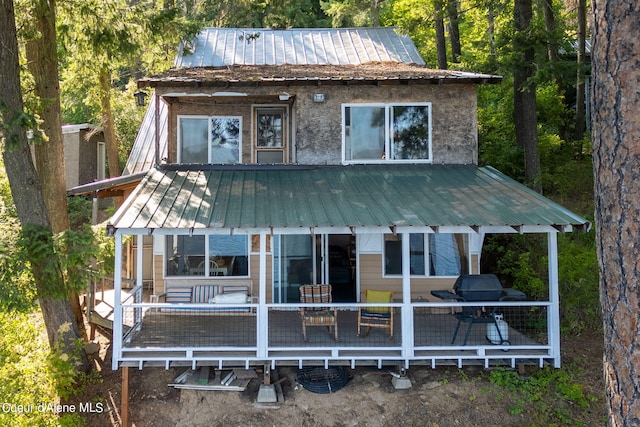 36799 W Coeur D Alene Lake Shr, Coeur Dalene, ID 83814 - rear view of house featuring a wooden deck and a metal roof