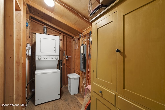 36799 W Coeur D Alene Lake Shr, Coeur Dalene, ID 83814 - washroom with stacked washer / dryer and light wood-style floors