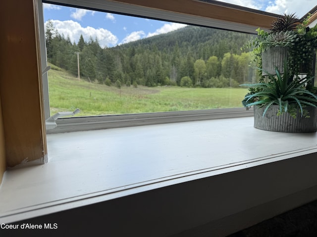 408 Quartz Crk Rd, Priest River, ID 83856 - unfurnished sunroom featuring a wooded view and plenty of natural light